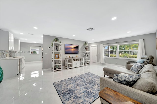 living room featuring sink