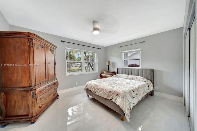 bedroom featuring ceiling fan and a closet