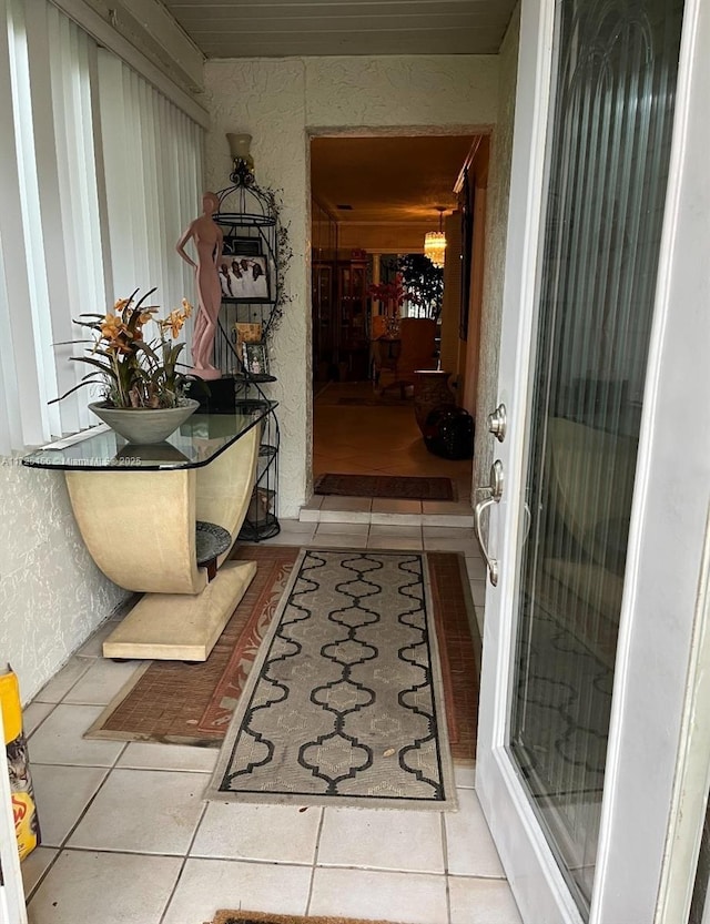 hallway with light tile patterned floors