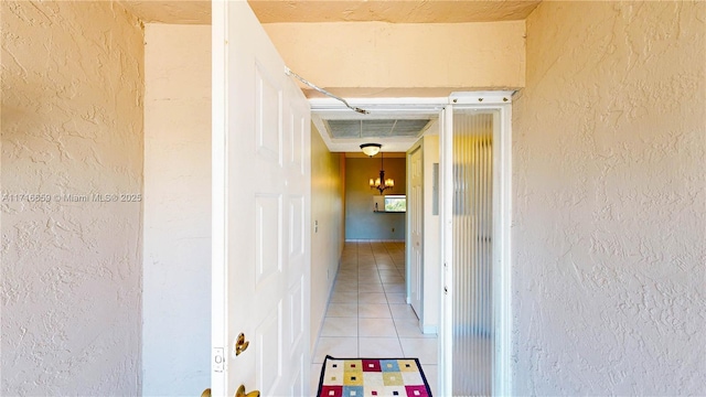 corridor featuring light tile patterned floors