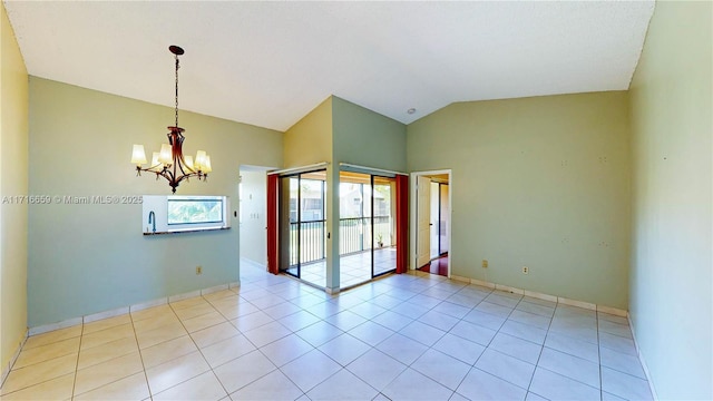 tiled empty room with lofted ceiling, french doors, and an inviting chandelier