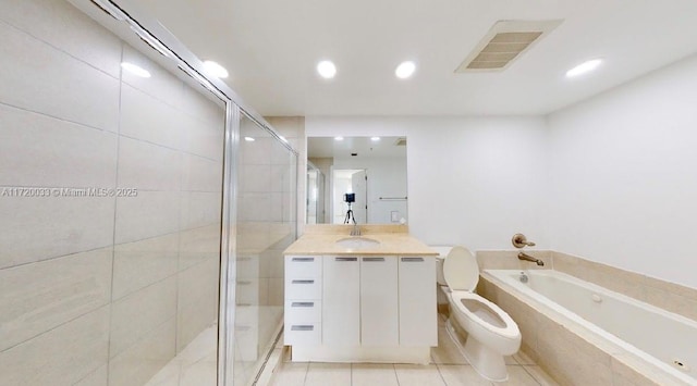 full bathroom with toilet, vanity, tile patterned flooring, and independent shower and bath