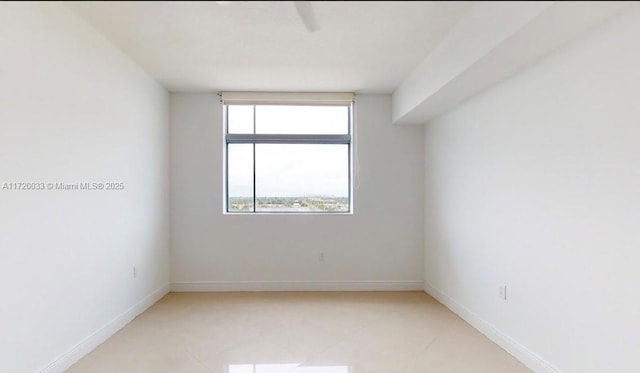 unfurnished room with light tile patterned floors