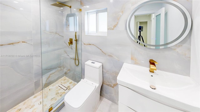 bathroom featuring tiled shower, vanity, toilet, and tile walls