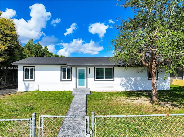 ranch-style house featuring a front lawn