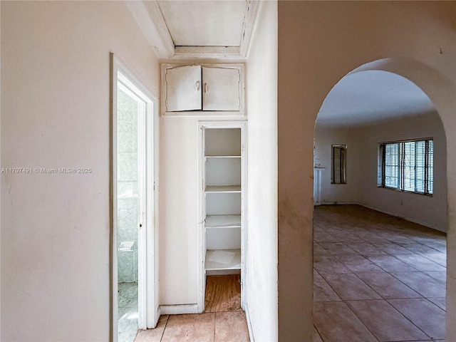 corridor with light tile patterned floors