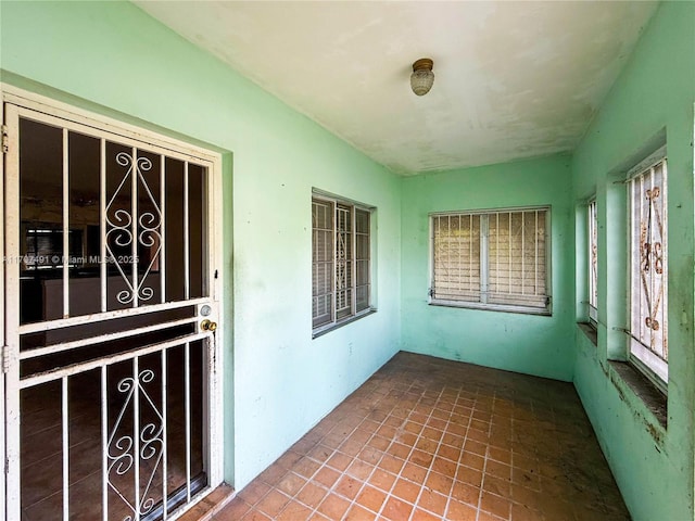 unfurnished sunroom with a healthy amount of sunlight