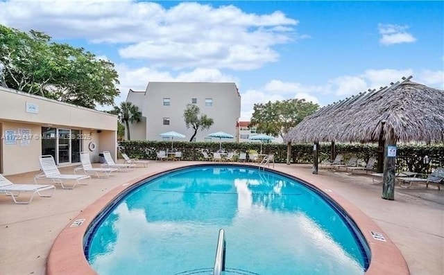 view of pool with a patio area and a gazebo