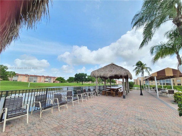 view of property's community featuring a water view and a gazebo