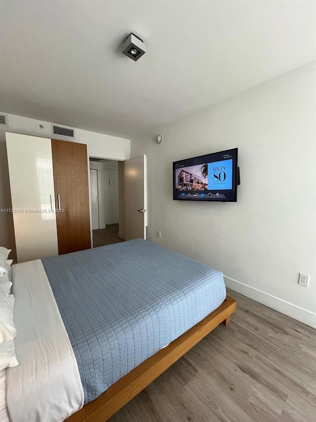 bedroom with wood-type flooring