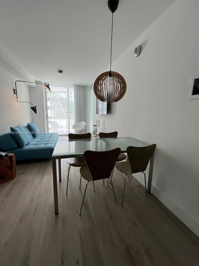 dining space featuring hardwood / wood-style flooring