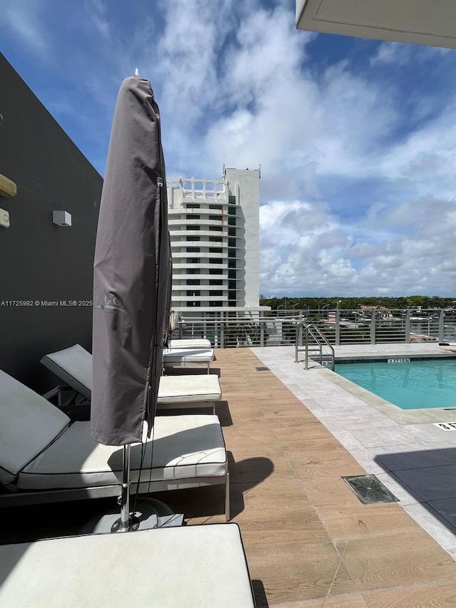 view of swimming pool with a patio