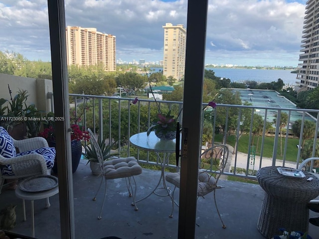 balcony featuring a water view