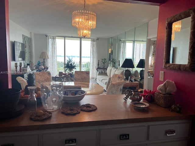 dining room with plenty of natural light and a notable chandelier