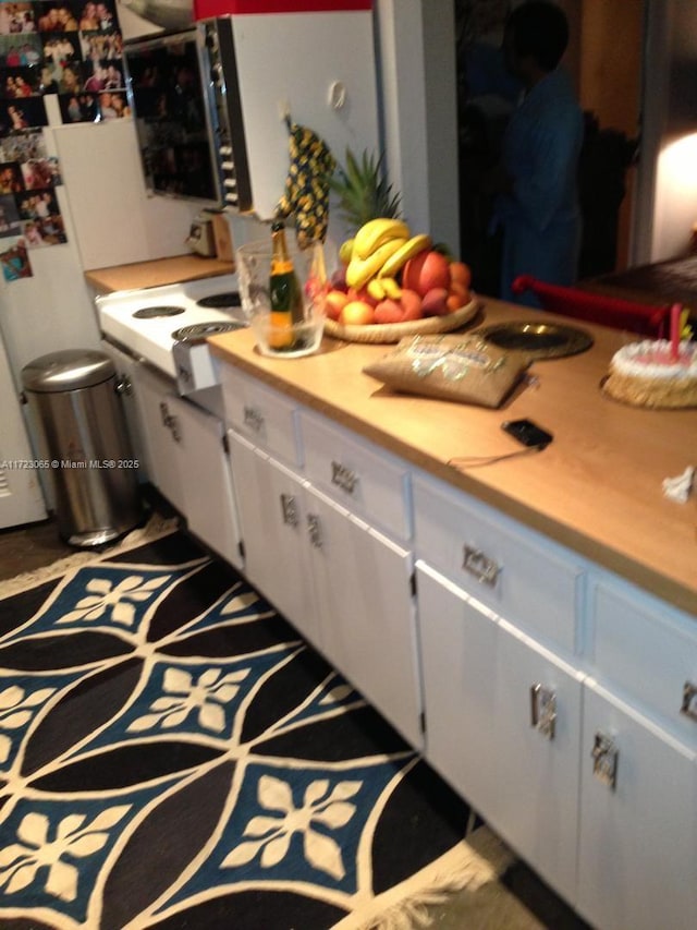 kitchen featuring white cabinetry