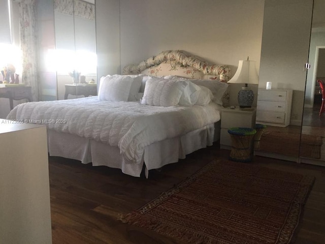 bedroom featuring dark hardwood / wood-style floors