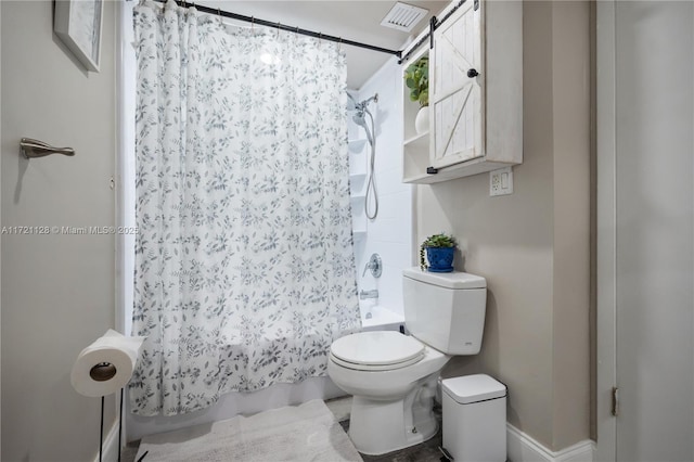 bathroom featuring toilet and shower / bath combo