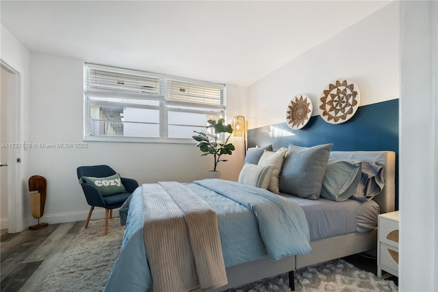 bedroom with wood-type flooring