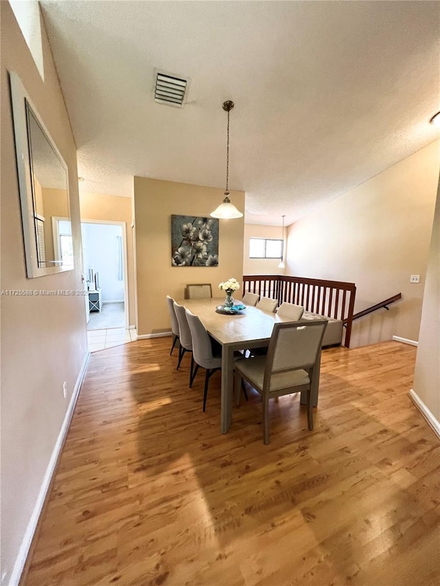 dining space featuring hardwood / wood-style floors