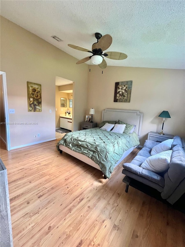 10 Via De Casas Sur Unit 205, Boynton Beach, FL 33426 - bedroom featuring visible vents, ceiling fan, a textured ceiling, wood finished floors, and lofted ceiling