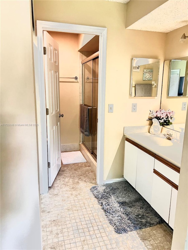 bathroom with vanity and walk in shower