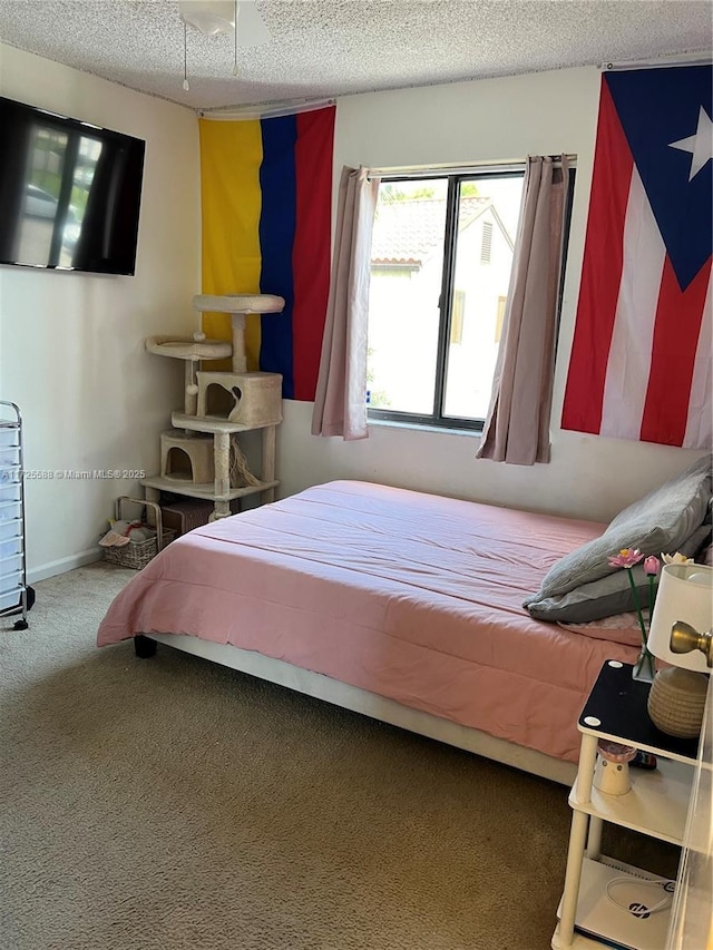 10 Via De Casas Sur Unit 205, Boynton Beach, FL 33426 - bedroom with a textured ceiling, carpet flooring, and baseboards