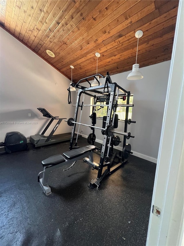 workout area with wood ceiling and vaulted ceiling