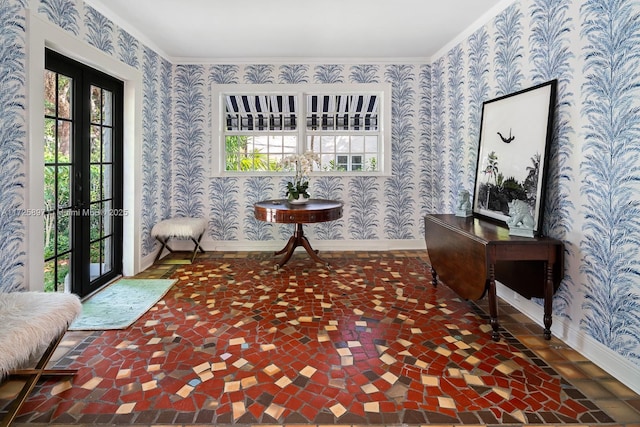 sitting room featuring french doors and crown molding