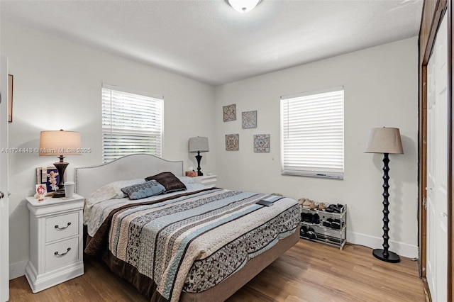 bedroom with light hardwood / wood-style flooring