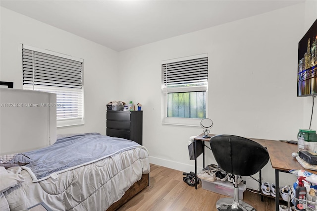 bedroom with light hardwood / wood-style floors