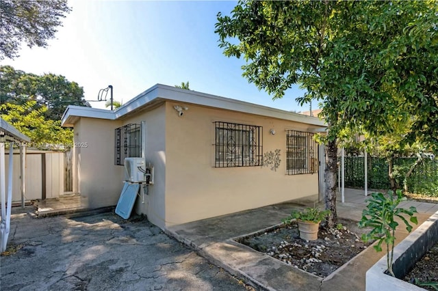 view of side of home featuring a patio area