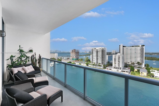 balcony featuring a water view