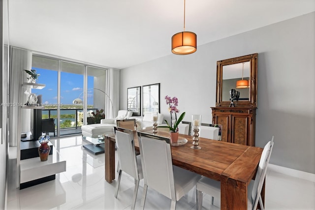 dining room with light tile patterned floors and floor to ceiling windows