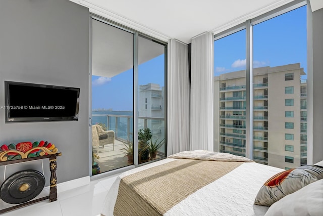 tiled bedroom featuring floor to ceiling windows and multiple windows