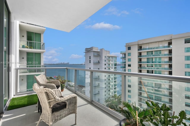 balcony featuring a water view