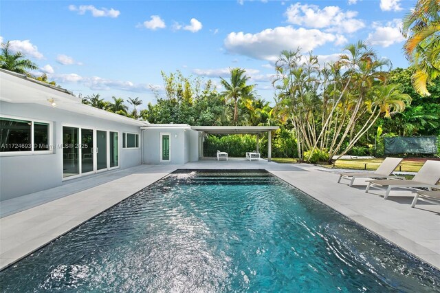 view of pool featuring a patio area