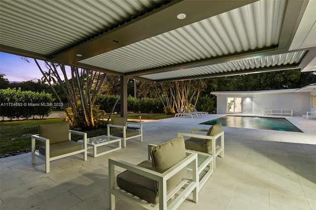 patio terrace at dusk with an outdoor hangout area