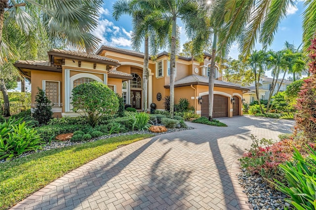 mediterranean / spanish-style house featuring a garage