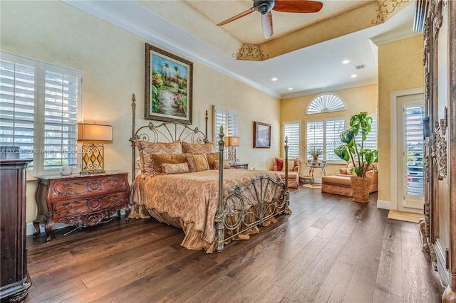 bedroom with ceiling fan, hardwood / wood-style flooring, and ornamental molding