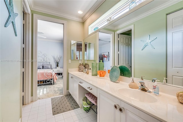 bathroom featuring ornamental molding, tile patterned floors, and vanity