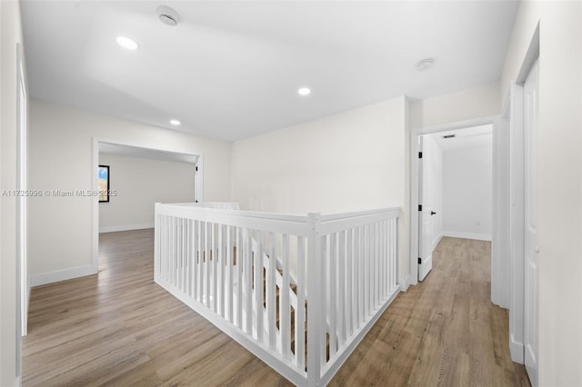 corridor with light hardwood / wood-style flooring