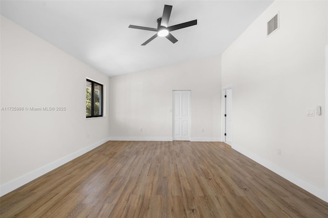 unfurnished room featuring ceiling fan, wood-type flooring, and lofted ceiling