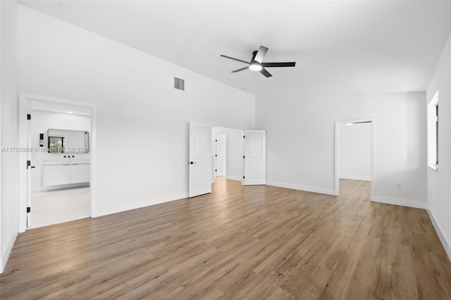 unfurnished living room with ceiling fan and light hardwood / wood-style flooring