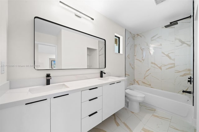 full bathroom with toilet, vanity, and tiled shower / bath