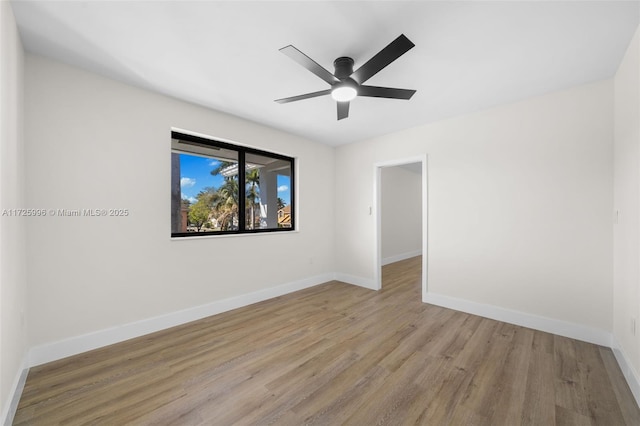 spare room featuring ceiling fan and light hardwood / wood-style floors