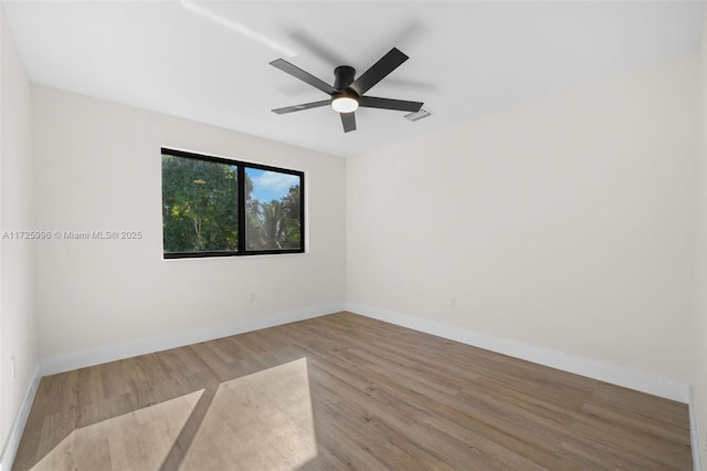 unfurnished room featuring ceiling fan and light wood-type flooring