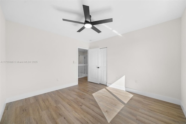 unfurnished room with ceiling fan and light hardwood / wood-style flooring