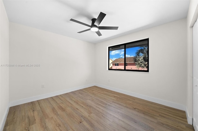 spare room with ceiling fan and light hardwood / wood-style floors