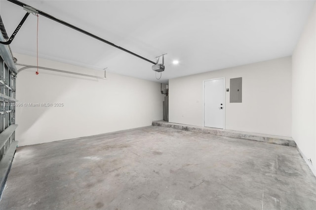 garage featuring electric panel and a garage door opener