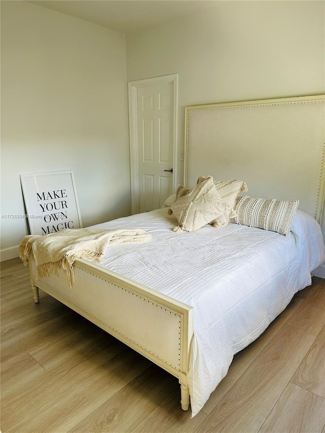 bedroom featuring hardwood / wood-style floors